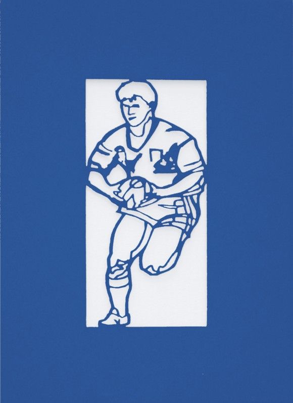 A Welsh greetings card laser cut card with a Welsh emblem representing a rugby player