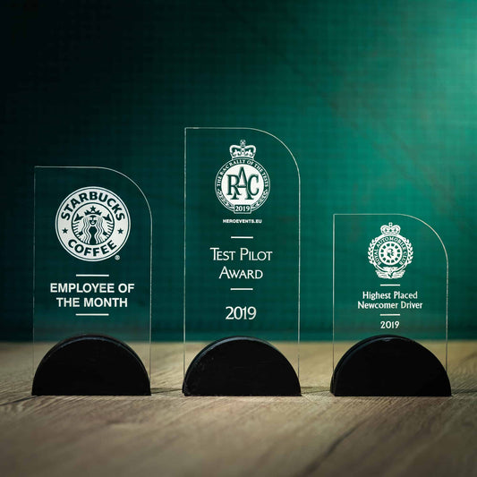 Three personalised laser engraved Arch Perspex trophies with a Welsh Slate base
