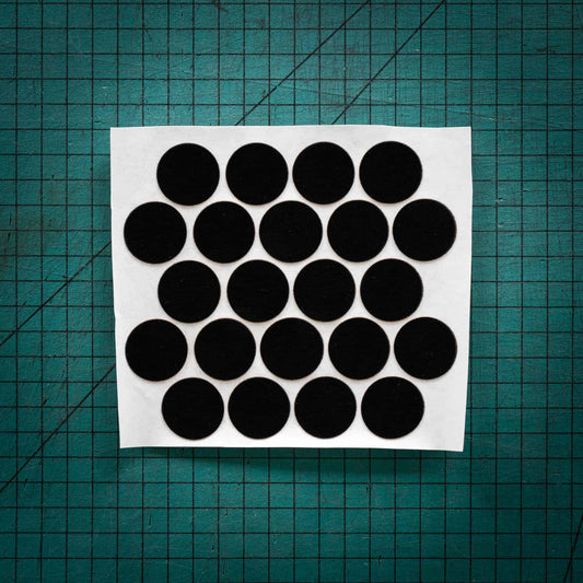 Black baize circles, sometimes known as felt, laser cut into circles