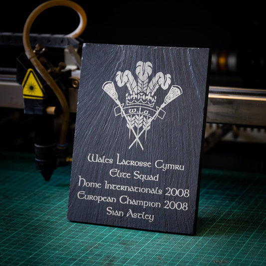 A medium black laser engraved slate trophy