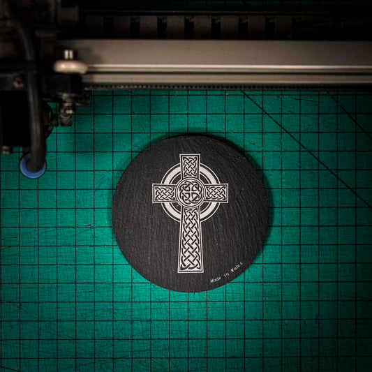 A laser engraved Welsh slate coaster with a Celtic cross