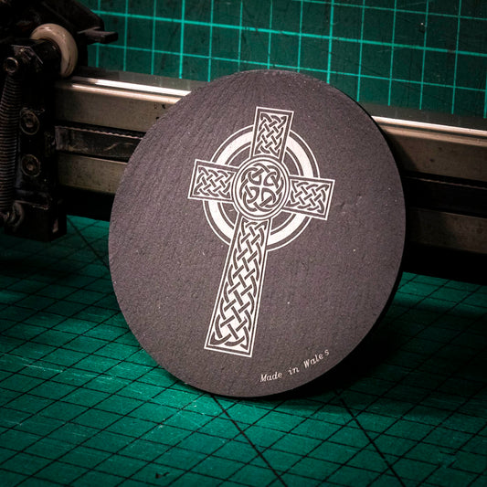 A laser engraved Welsh slate coaster with a Celtic cross