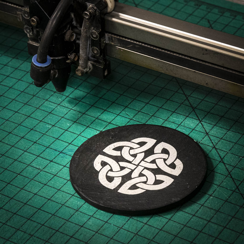 A laser engraved Welsh slate coaster with a Celtic Knot