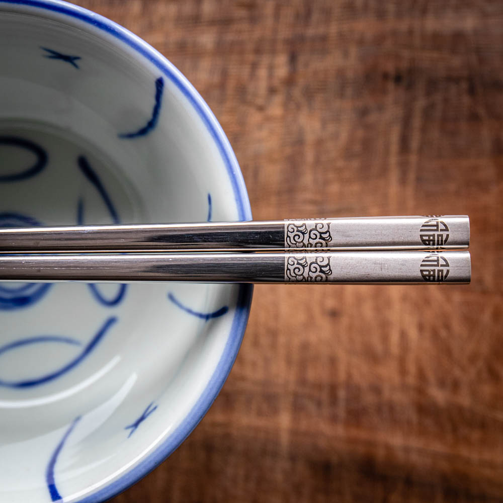 A personalised pair of metal Chinese chopsticks that can be laser engraved with a name
