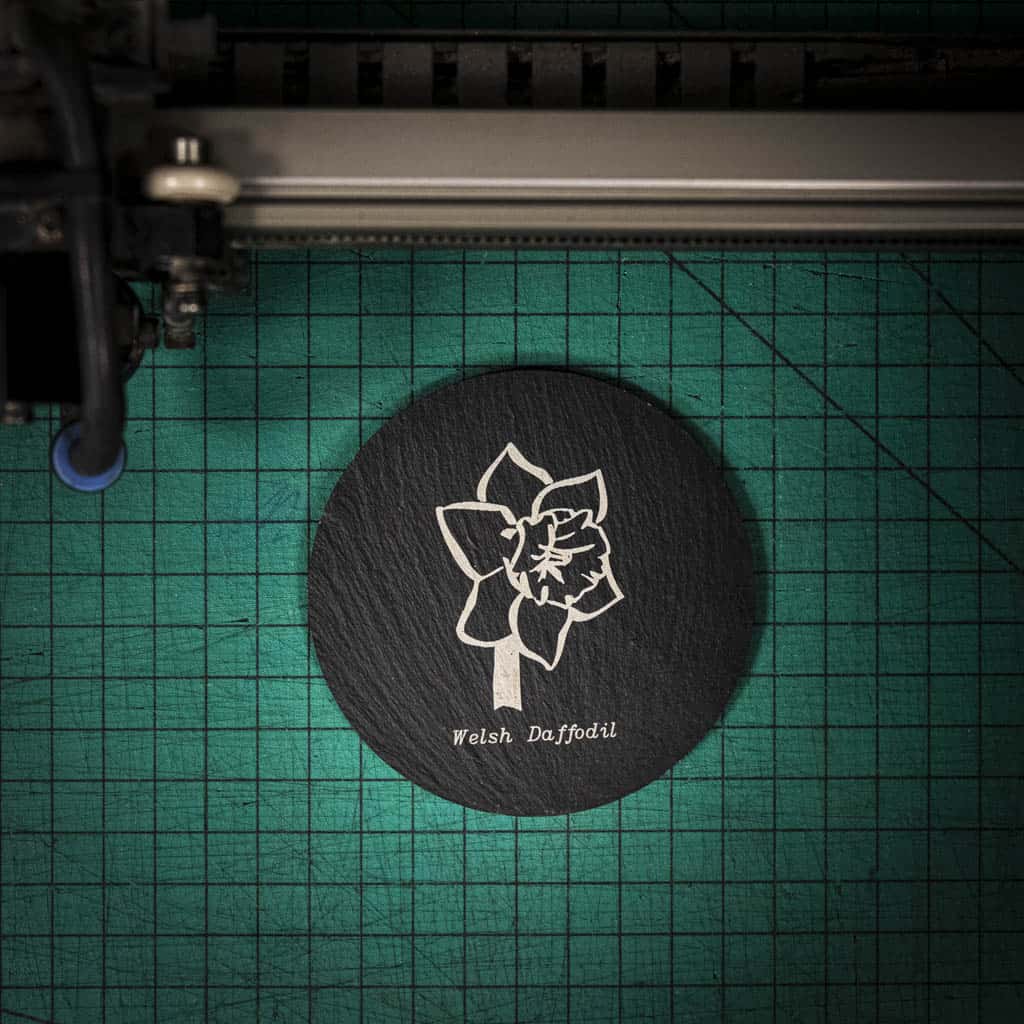 A laser engraved Welsh slate coaster with a welsh daffodil