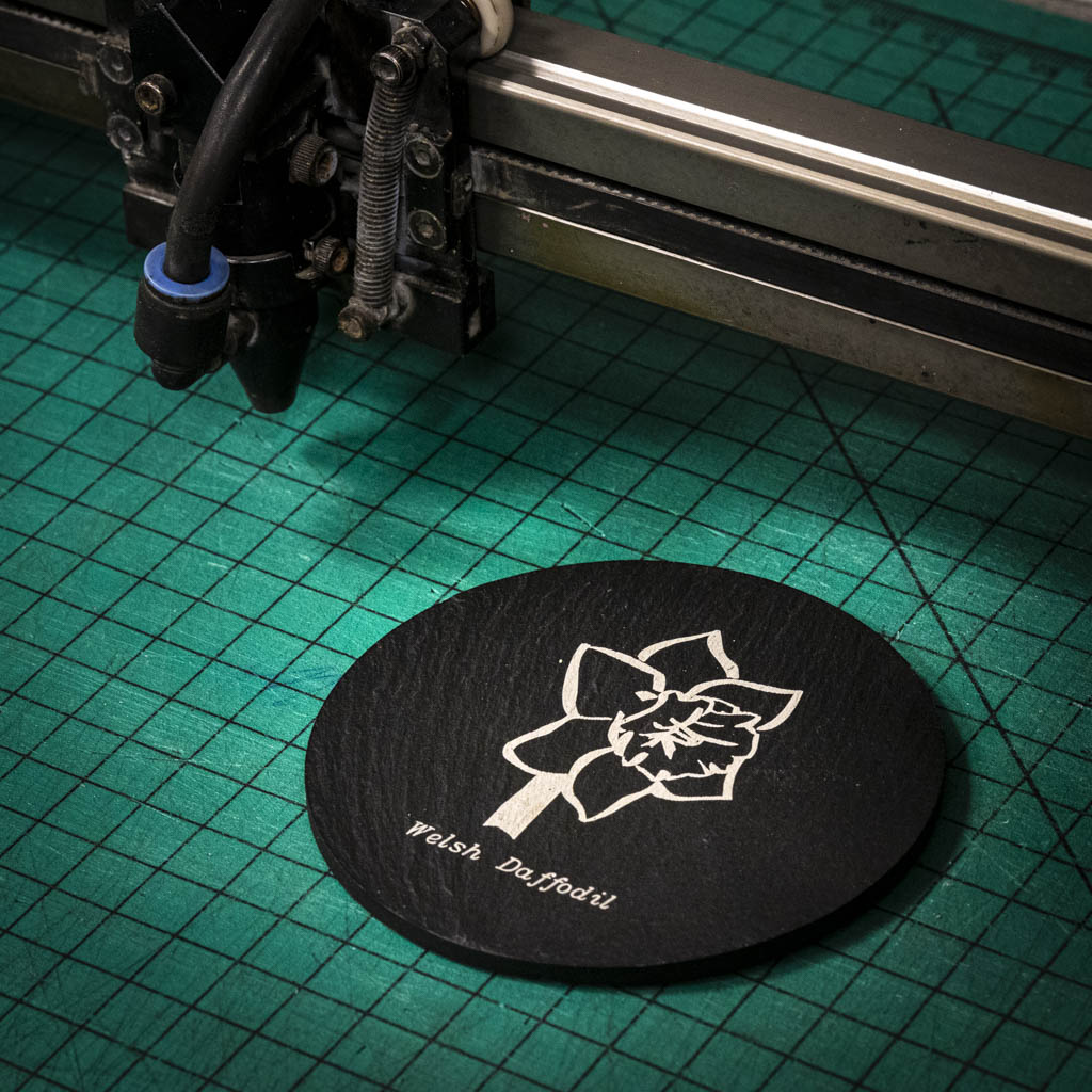 A laser engraved Welsh slate coaster with a welsh daffodil