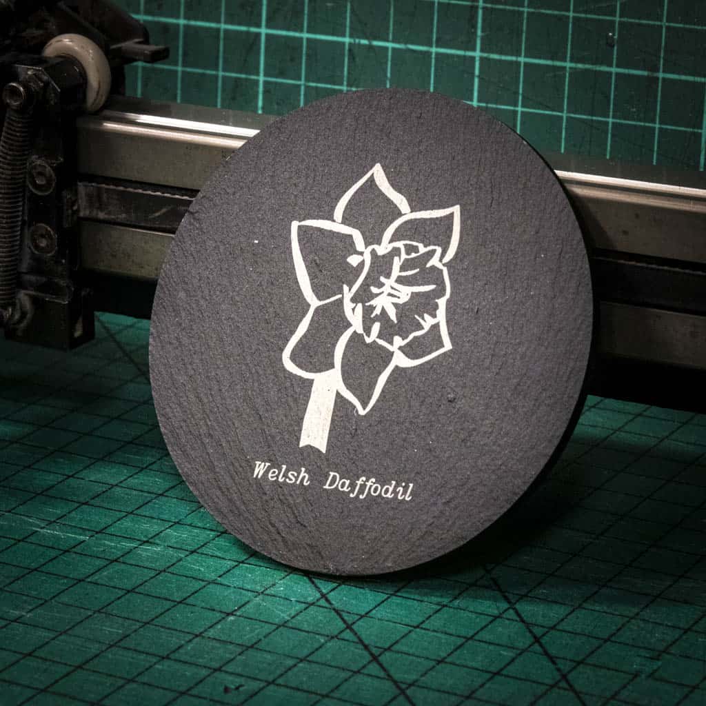 A laser engraved Welsh slate coaster with a welsh daffodil