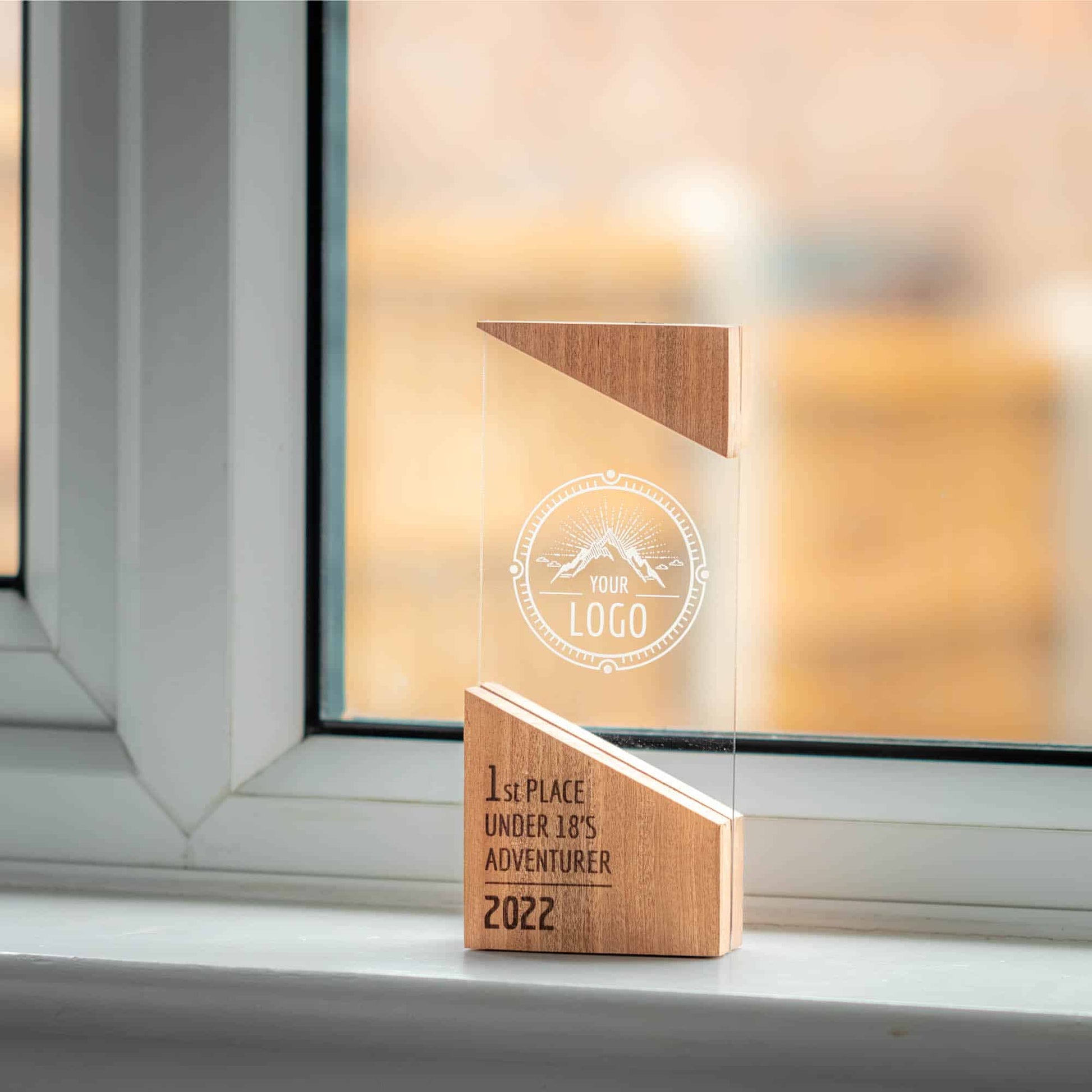 A artistic personalised laser engraved perspex trophies with a wooden base