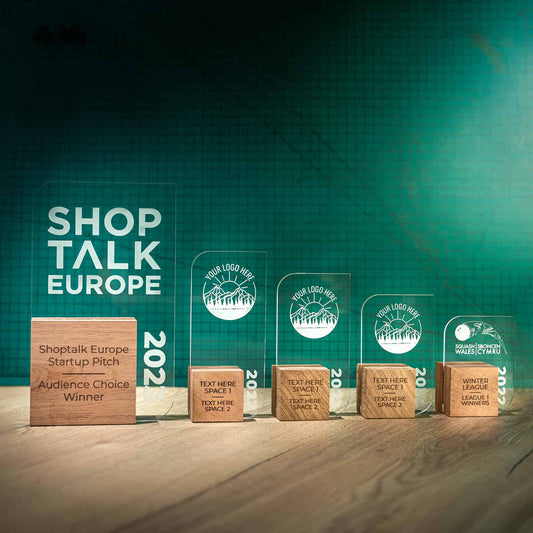 Leaf Trophies, five personalised laser engraved Perspex trophies with an eco friendly wooden base