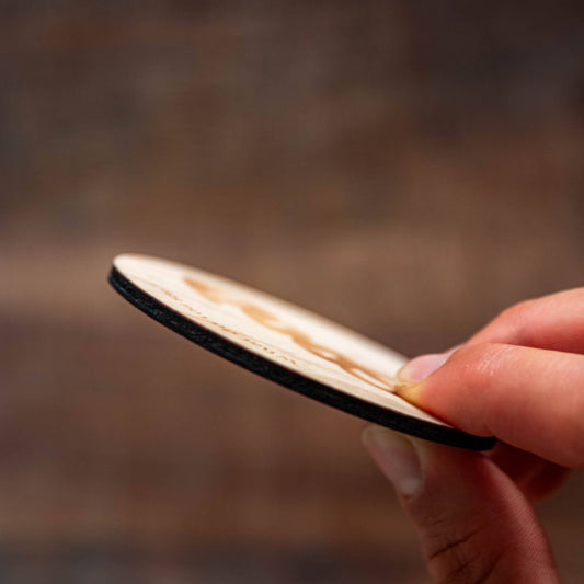 Showing the thickness of a personlized wooden coaster