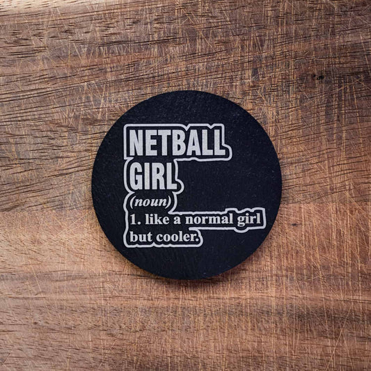 A Welsh slate coaster laser engraved with a netball quote "Netball Girl (noun) like a normal girl but cooler"