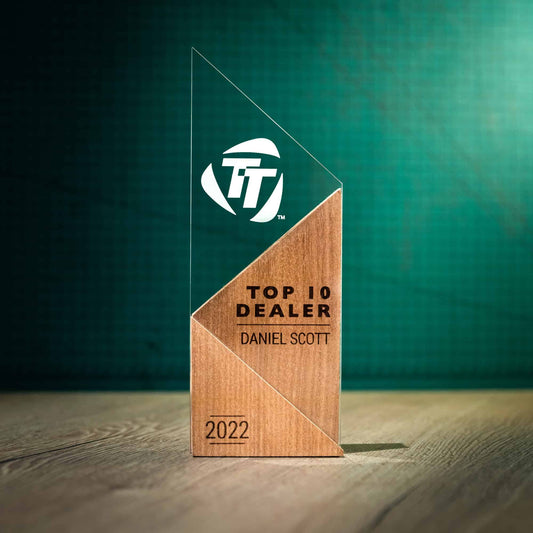 A large personalised laser engraved perspex trophies with a wooden base