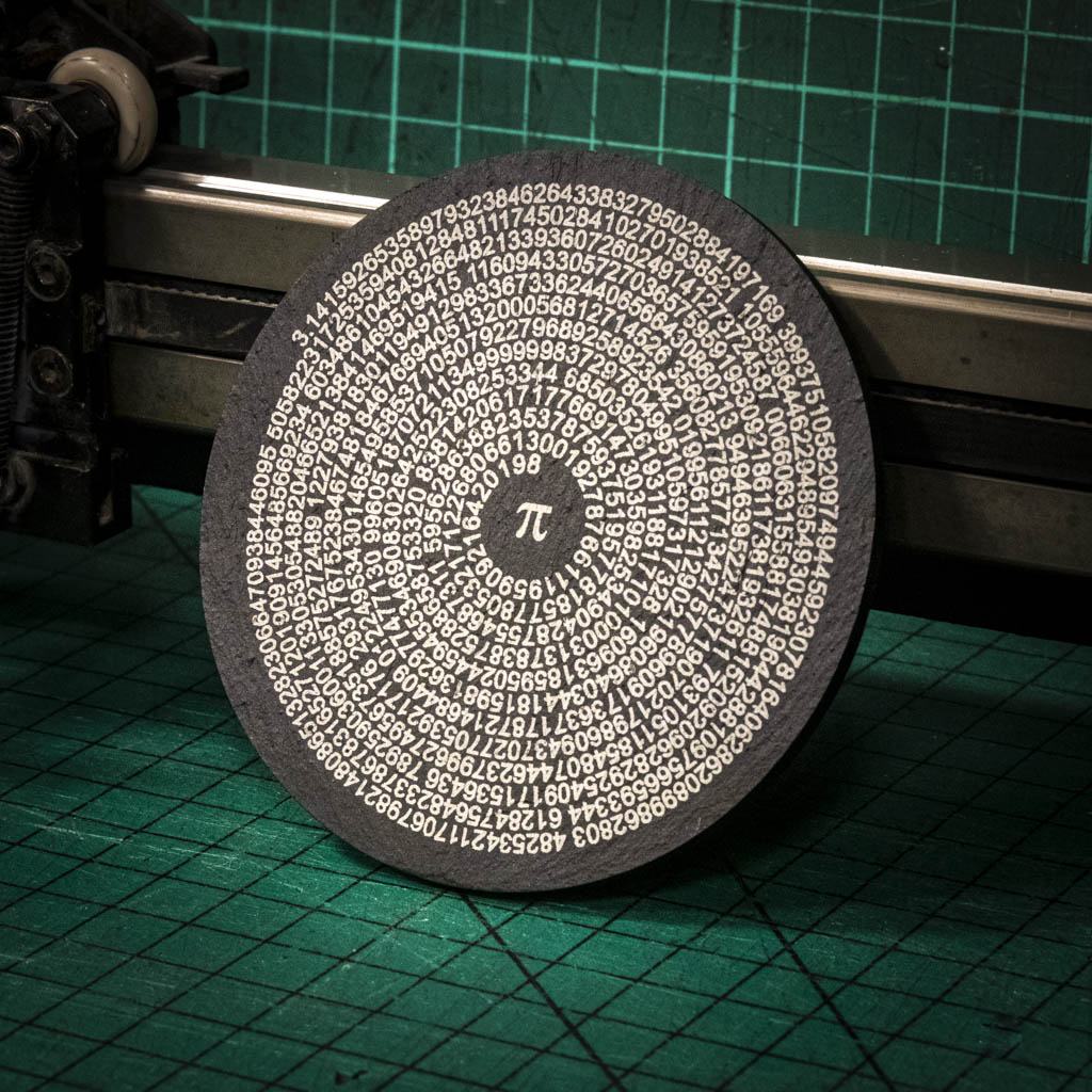 A laser engraved Welsh slate coaster with pi to 500 figures in a circle