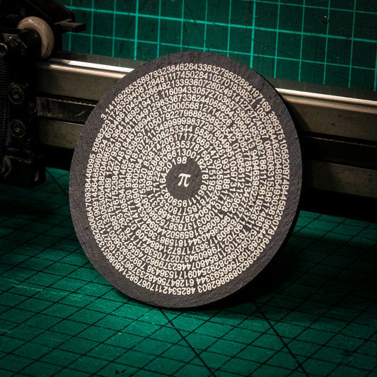 A laser engraved Welsh slate coaster with pi to 500 figures in a circle