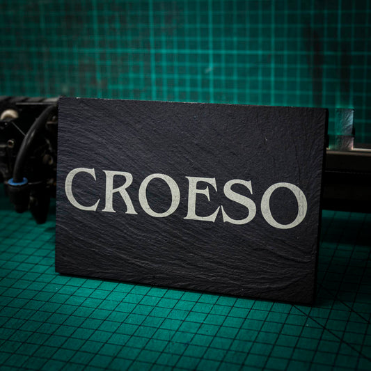 A welsh slate stand up plaque laser engraved with the welsh word for welcome, croeso