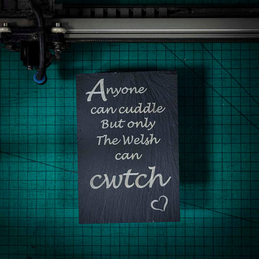 A welsh slate stand up plaque laser engraved with anyone can cuddle but only the welsh can cwtch