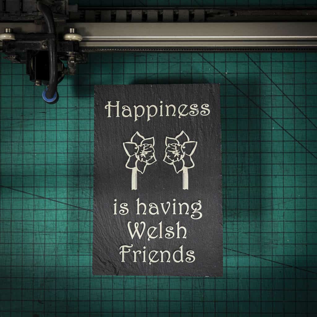 A welsh slate stand up plaque laser engraved with happiness is having welsh friends and two welsh daffodils