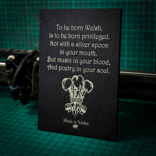 A welsh slate stand up plaque laser engraved with a poem about being welsh with the welsh feathers emblem
