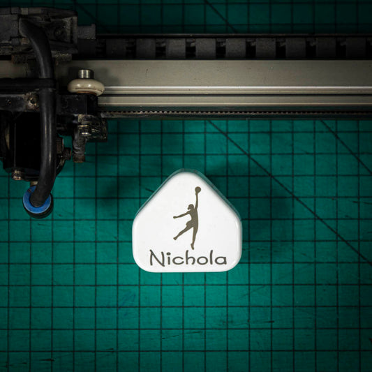 A laser engraved apple USB plug personalised with a name and image