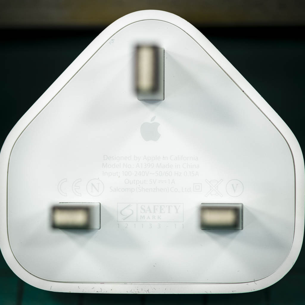 A laser engraved apple USB plug personalised with a name and image