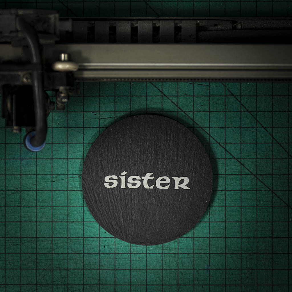 A Welsh slate coaster laser engraved with the word sister