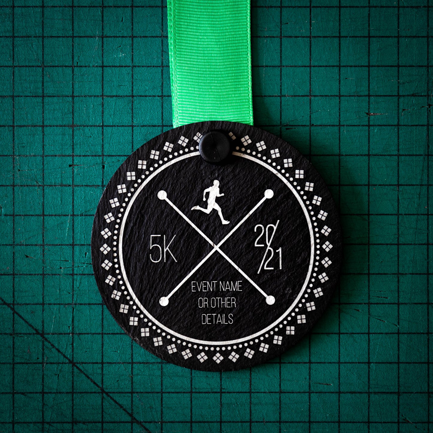 A personalised laser engraved Welsh slate sports medal