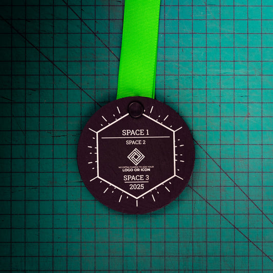 A personalised laser engraved Welsh slate sports medal