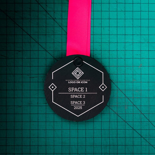 A personalised laser engraved Welsh slate sports medal