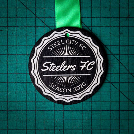 A personalised laser engraved Welsh slate running medal