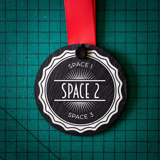 A personalised laser engraved Welsh slate sports medal