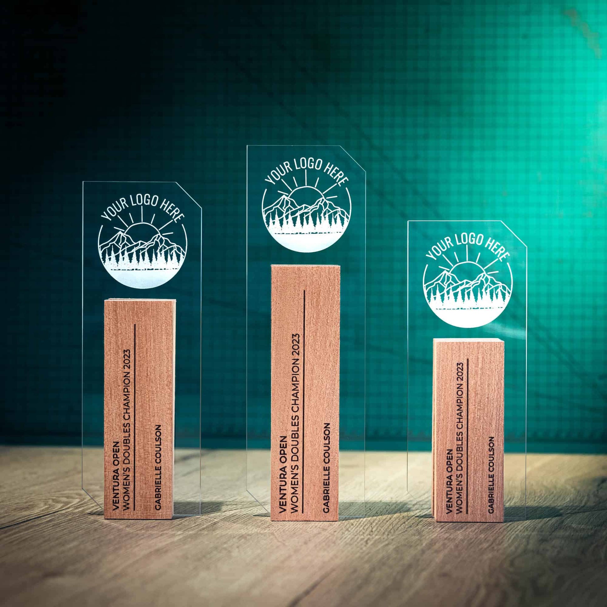Three Tower Trophies, an artistic personalised laser engraved perspex trophy with a wooden base