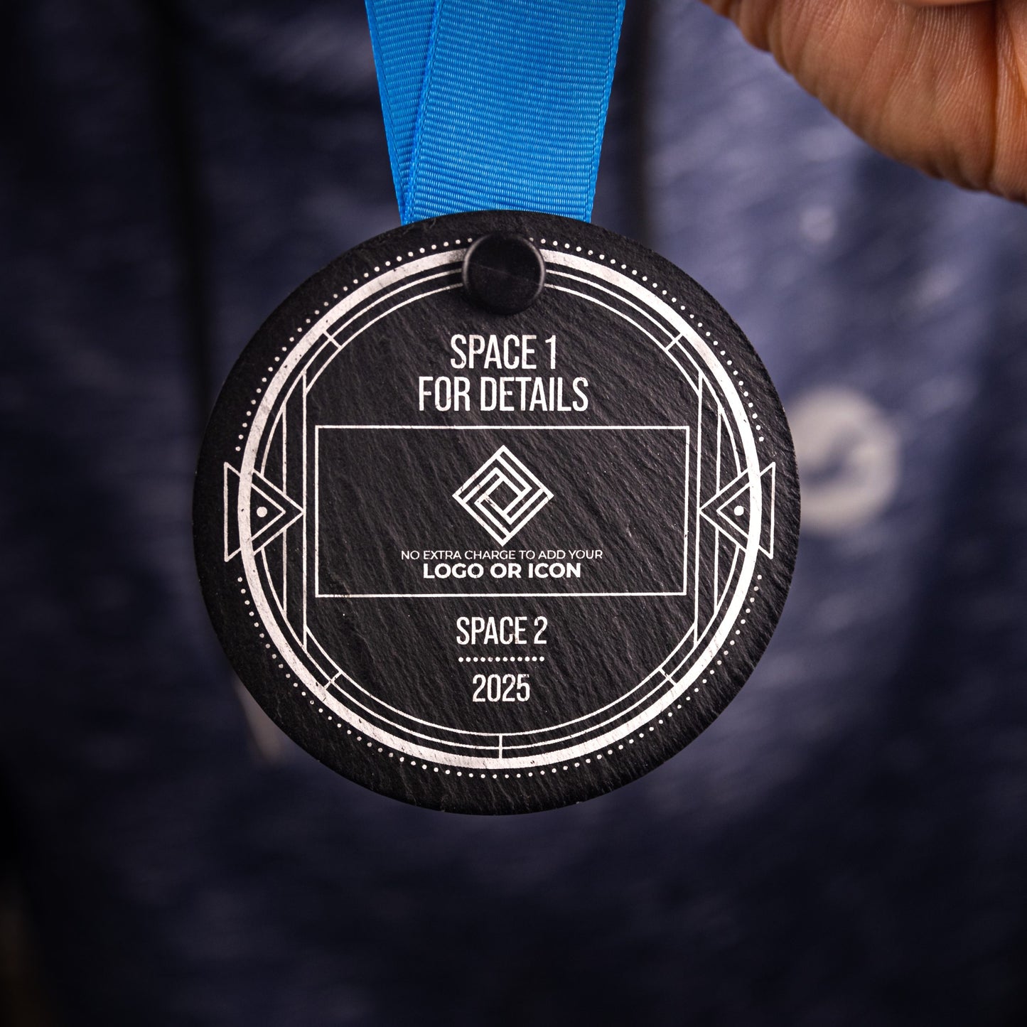 A personalised laser engraved Welsh slate sports medal