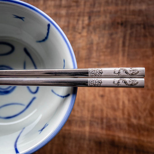 A personalised pair of metal Chinese Zodiac chopsticks that can be laser engraved with a name