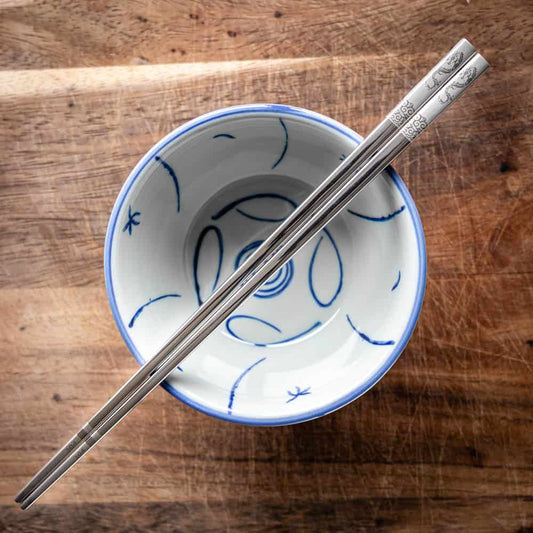 A personalised pair of metal Chinese Zodiac chopsticks that can be laser engraved with a name