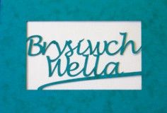 A laser cut card with the welsh word Brysiwch Wella