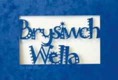 A laser cut card with the welsh word Brysiwch Wella
