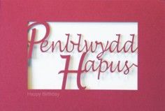 A laser cut card with the welsh word Penblwydd Hapus