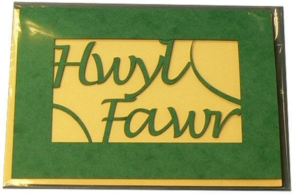 A laser cut card with the welsh word Hwyl Fawr