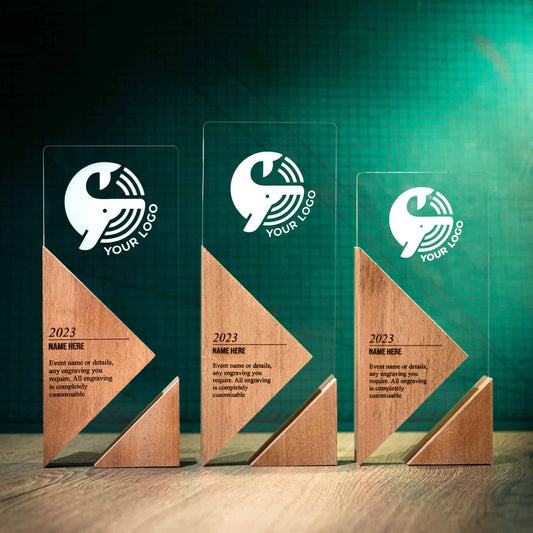 Three Apex Trophies, an artistic personalised laser engraved perspex trophy with a wooden base