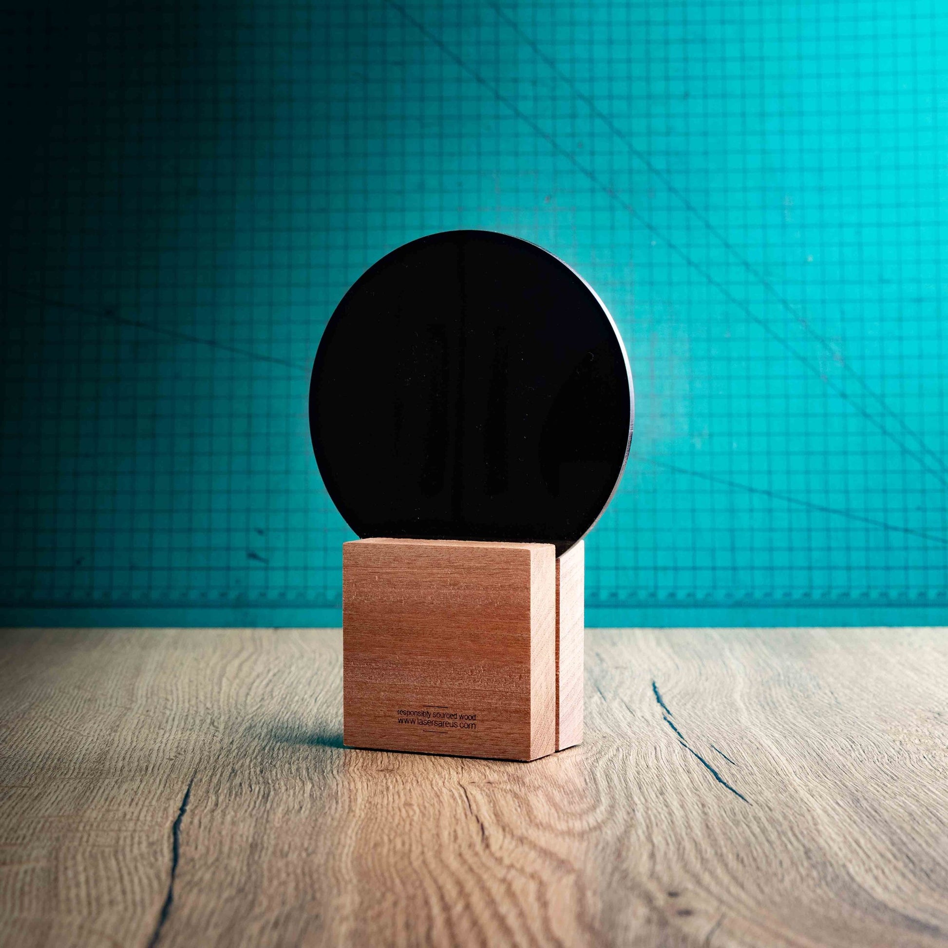 A back view of a medium Baseball trophy with custom text and logos, on an eco-friendly wooden base, with a black Perspex Baseball mounted on top, featuring fully customisable areas for text and logos.