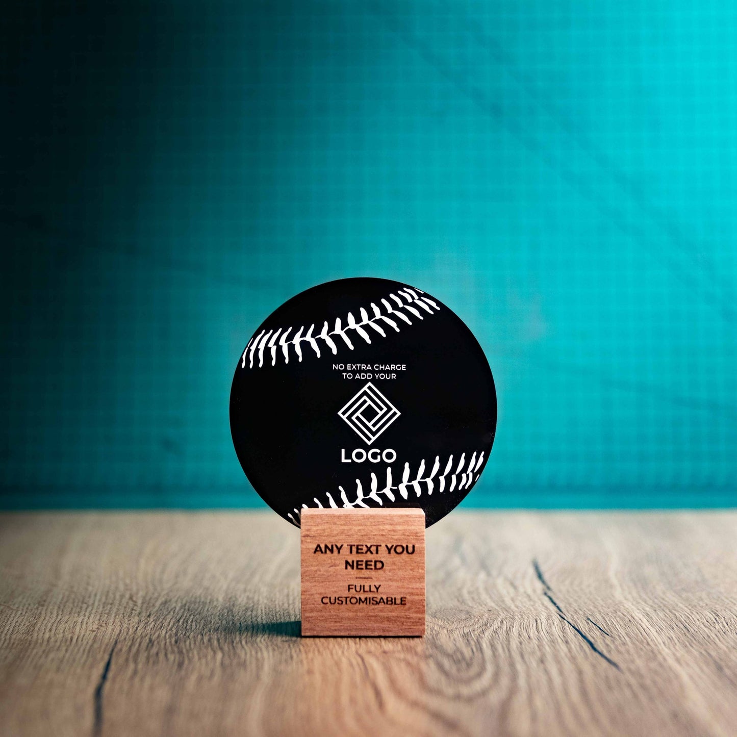 A small Baseball trophy with custom text and logos, on an eco-friendly wooden base, with a black Perspex Baseball mounted on top, featuring fully customisable areas for text and logos.