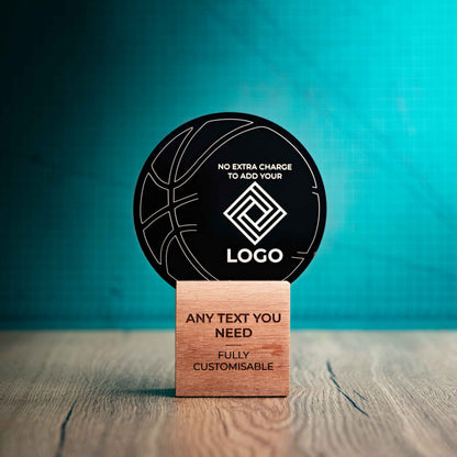 A medium Basketball trophy with custom text and logos, on an eco-friendly wooden base, with a black Perspex Basketball mounted on top, featuring fully customisable areas for text and logos.