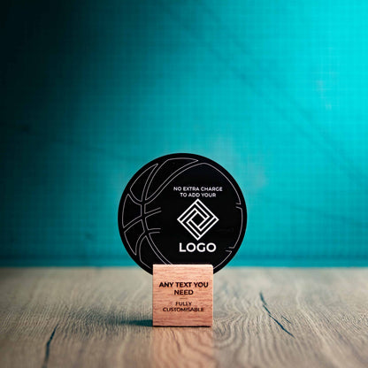 A small Basketball trophy with custom text and logos, on an eco-friendly wooden base, with a black Perspex Basketball mounted on top, featuring fully customisable areas for text and logos.