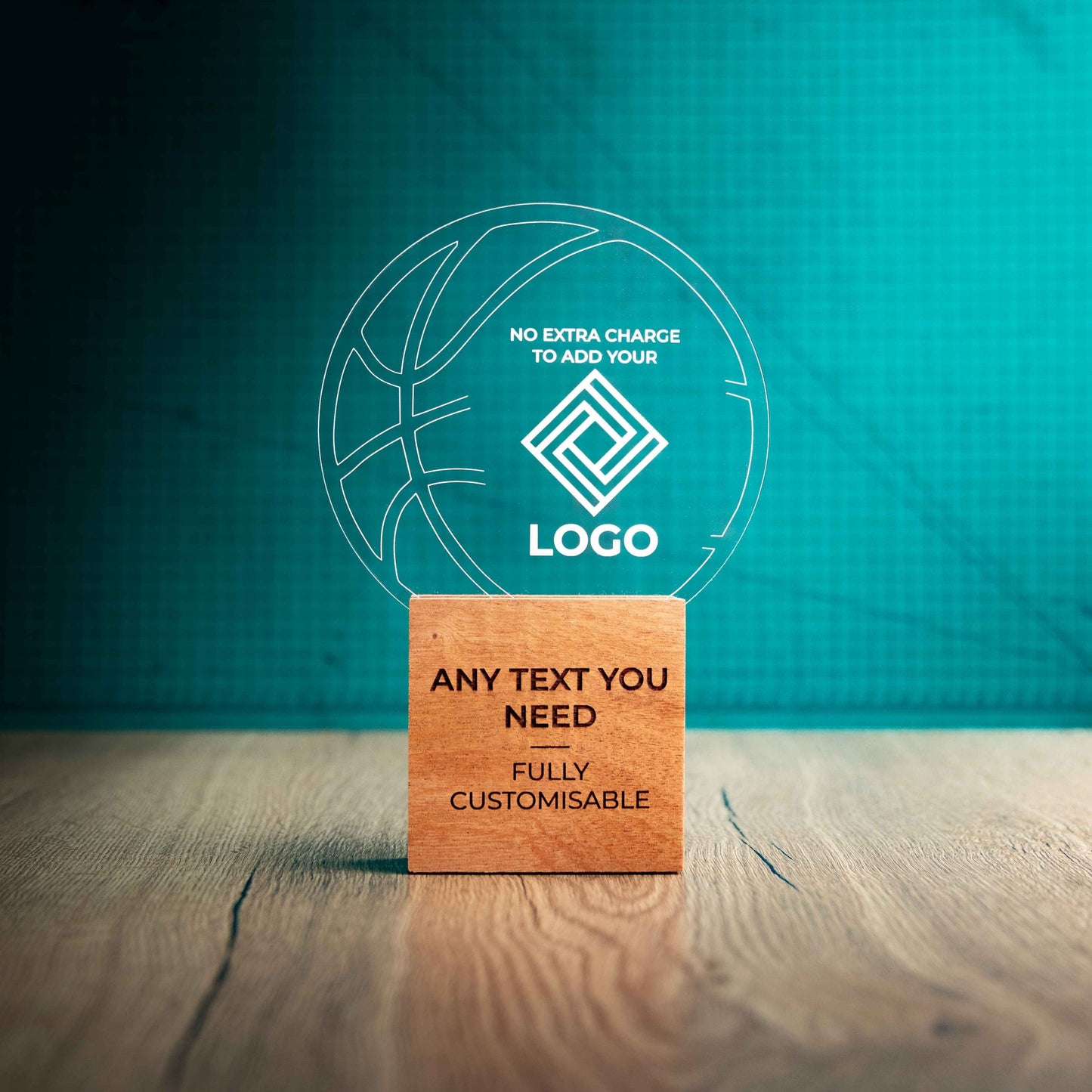 A large Basketball trophy with custom text and logos, on an eco-friendly wooden base, with a clear Perspex Basketball mounted on top, featuring fully customisable areas for text and logos.