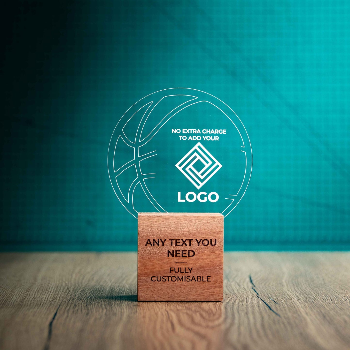 A medium Basketball trophy with custom text and logos, on an eco-friendly wooden base, with a clear Perspex Basketball mounted on top, featuring fully customisable areas for text and logos.