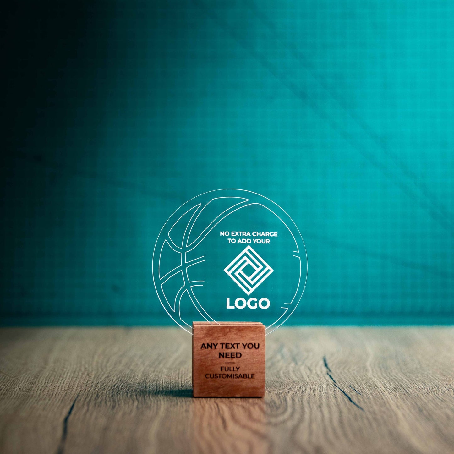 A small Basketball trophy with custom text and logos, on an eco-friendly wooden base, with a clear Perspex Basketball mounted on top, featuring fully customisable areas for text and logos.