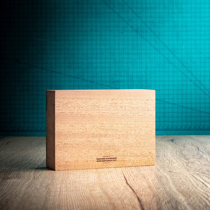 Rear view of the medium Bezel wooden trophy showing the plain natural wood back, substantial block construction and small responsibly sourced wood marking near the bottom.