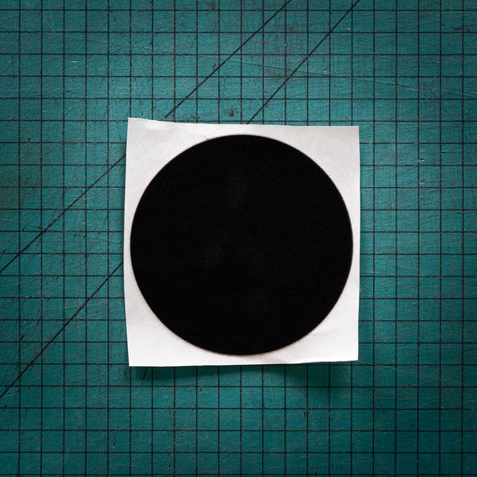 Black baize circle, sometimes known as felt, laser cut into one big circle
