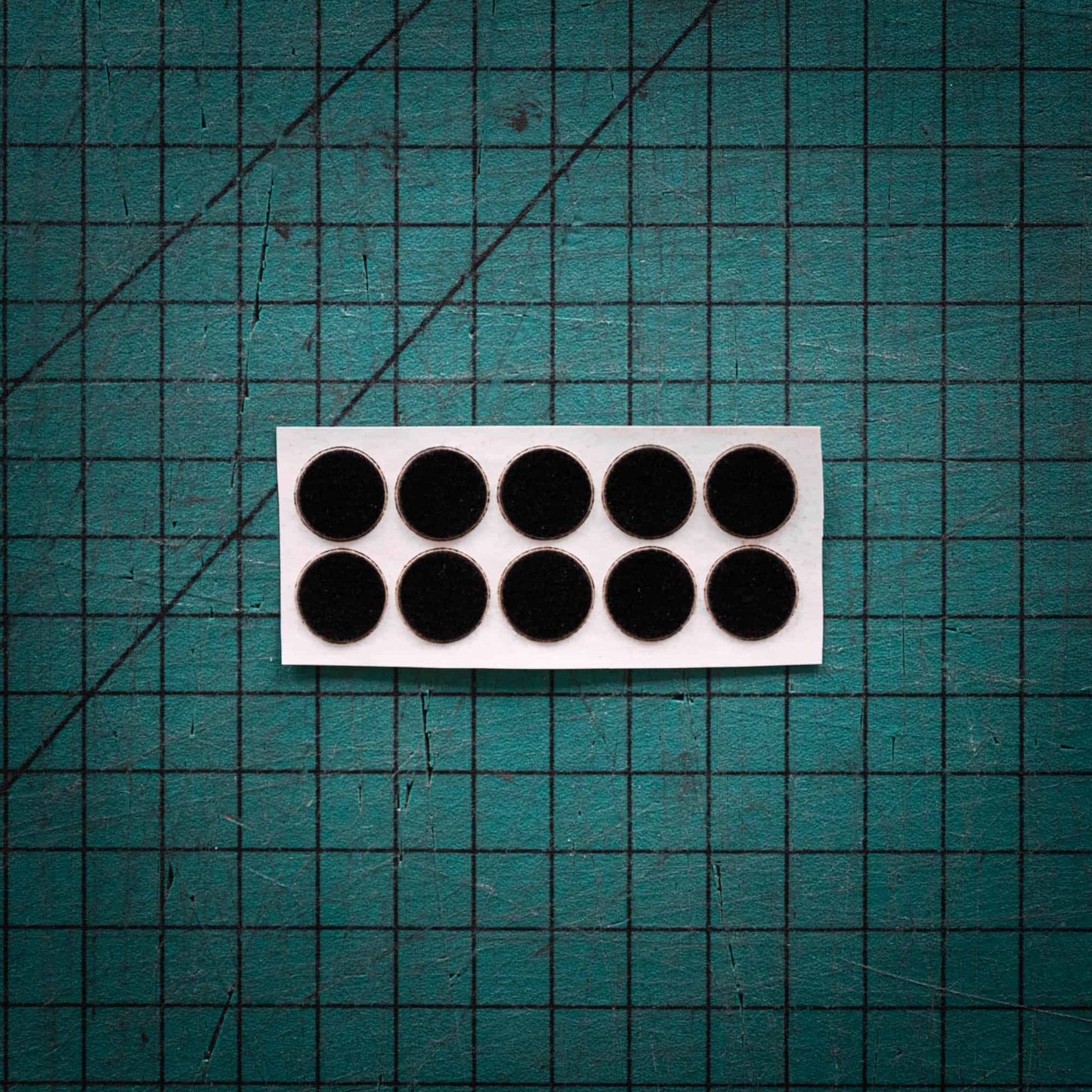 Black baize circles, sometimes known as felt, laser cut to various sizes.