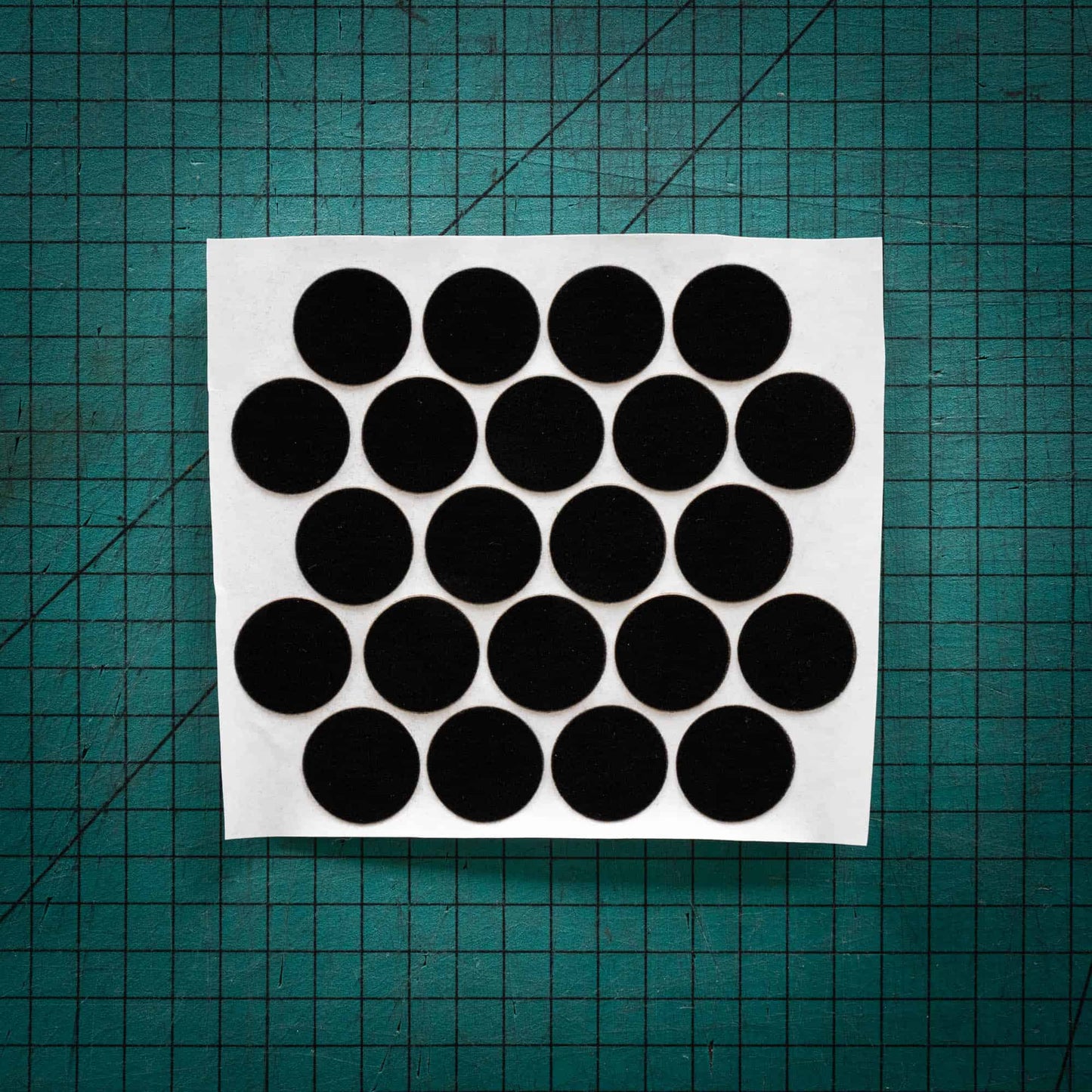 Black baize circles, sometimes known as felt, laser cut into circles